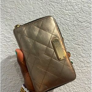 Marc Jacobs gold tone wallet available!